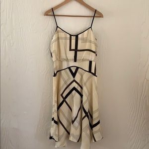 Spaghetti strap dress in cream and black.